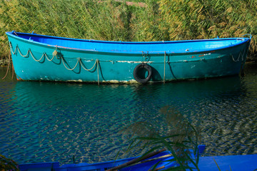 Turquois Boat in River
