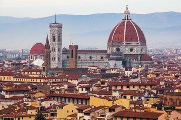 Fototapeta na wymiar The Duomo in Florence rising above the city of Florence. 