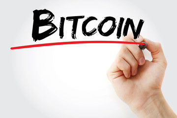 Hand writing Bitcoin with marker, concept background