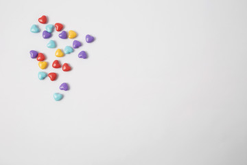 Miniature plastic hearts love on white background