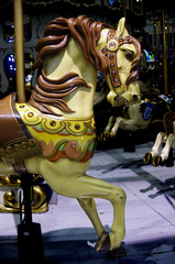 Fototapeta na wymiar Brown carousel horse on merry-go-round