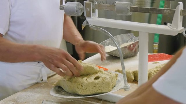 german baker bread dough weighing of a portioning machine close 4k 11722
