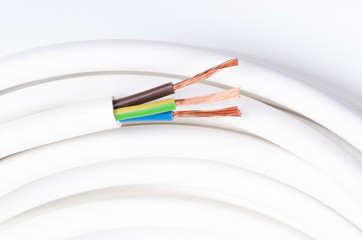 Electrical cable with three insulated conductors. Horizontal. Power cable cross-section. Cable...