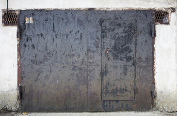 Naklejka premium old metal warehouse door, hangar, high resolution photo 