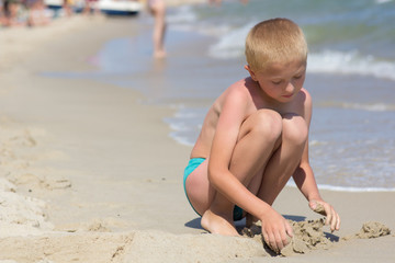 child playing on the beach