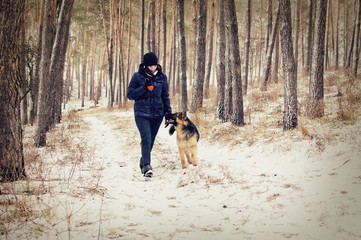 Woman and dog on a winter walk