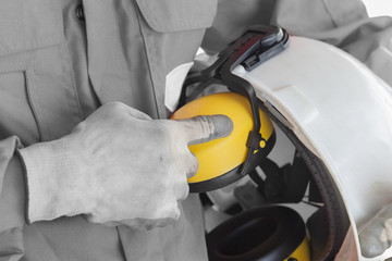 Safety concept, Worker showing finger index to safety helmet