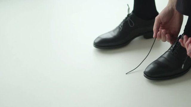 Shoes tying. Fashion background.