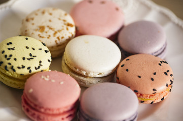 macro french macarons cookies dessert on a white plate