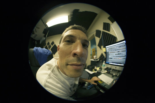 Fisheye view of man working at computer