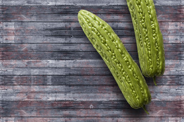 Bitter melon isolated on wooden background, Momordica charantia L.Cucurbitaceae, Bitter cucumber-chinese