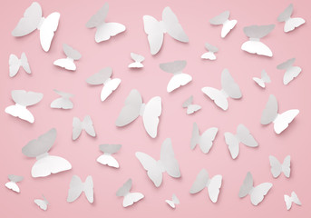 Flat lay paper butterflies pattern on pink background. Love and Valentine's day concept. Top view