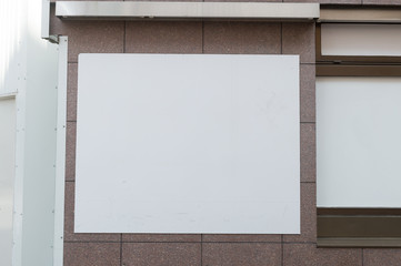  Large blank billboard on a street wall,  banners with room to add your own text