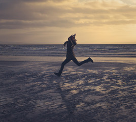 Girl Running on WInter Beach