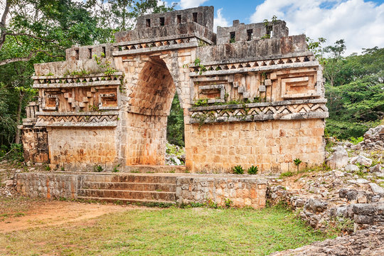 The overgrown outer face of Labna's Mayan vaulted arch
