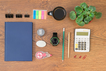 Office stationery on wooden table top view.