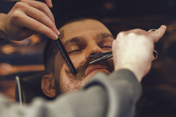 Fototapeta na wymiar Bearded Man In Barbershop
