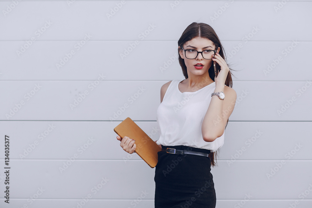 Wall mural beautiful brunette with glasses