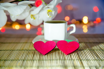 cup of coffee and two red hearts
