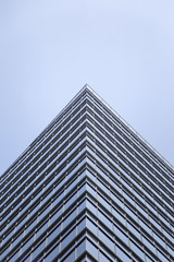 Fototapeta na wymiar Modern glass facade of an office building in Tokyo