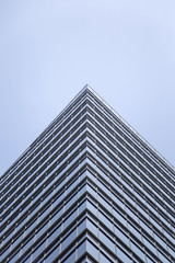 Modern glass facade of an office building in Tokyo