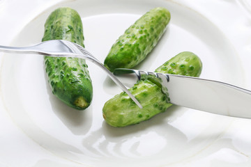 Pickled cucumbers on plate