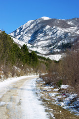 Fototapeta na wymiar Desert mountain road on a sunny winter day