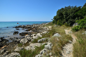 Fototapeta na wymiar Croatia, typical footpath along the coast - Novalja