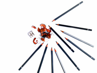 pencil with shavings and pencil sharpener isolated on white background