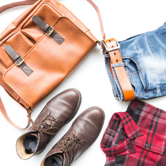 Men's casual outfits with leather bag, red plaid shirt, blue jeans, man clothing and accessories travel items on white background
