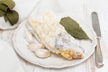 cod fish with ice on plate