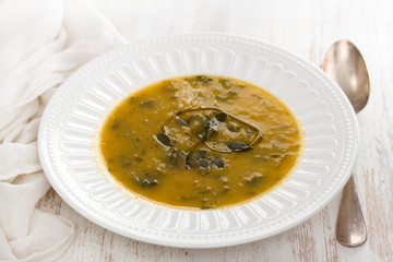 vegetable soup with spinach on plate