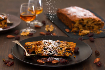 cake with dry fruits on brown plate