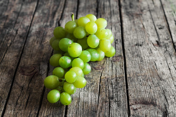 Grapes on wooden background