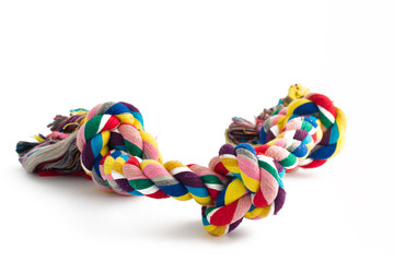 colorful cotton dog toy on a white background