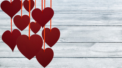 Red hearts on gray planks. Valentine's Day background.