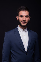young adult man smirking suit elengant