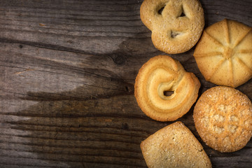 Butter cookies over wood with copy space