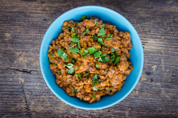 Lentil stew in a bowl with parsley