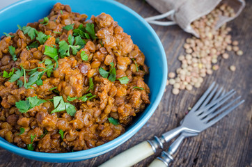 Lentil stew in a bowl with parsley