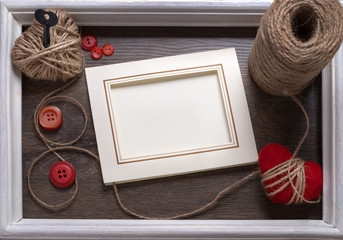 White photo frame on wooden table over  background, Valentine concept