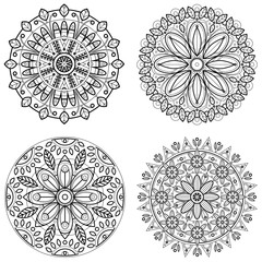 Four round ornaments - spring flower. Mandala set for coloring book. Abstract vector lace designs.