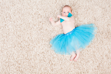 Fototapeta na wymiar little girl ballerina in blue skirt