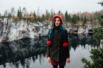 Pretty nice girl enjoy beautiful lake view from the hilltopl and good weather in Karelia. Around the rocks.