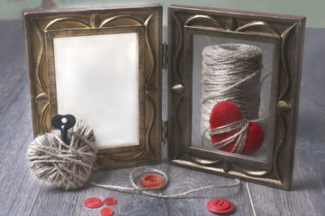 Photo frames and handmaded valentines day toy hearts over wooden background. with copy space