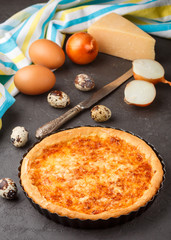 Homemade gourmet pie with cheese, onions and eggs

