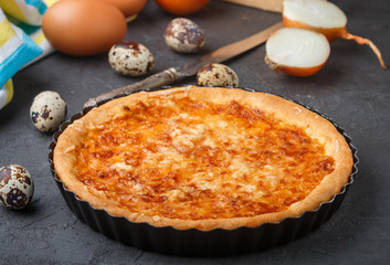 Homemade gourmet pie with cheese, onions and eggs
