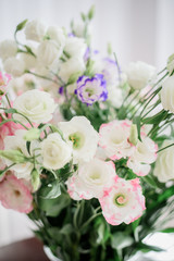 Naklejka na ściany i meble White bouquet made of lilies and roses