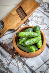 Fresh cucumbers in a wooden bowl.