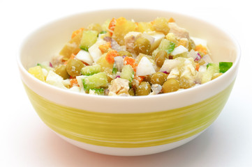 Russian dish called winter salad. Healty food in a bowl isolated